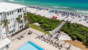 A resort with a pool, beach, and ocean view. - 30A Sunset Beach House - Villa Infinity (Panama City Beach)