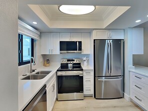 Fridge, microwave, oven, stovetop - Seaside 205 | Renovated Gulf-Front Condo w/ Pool, Beach Access + Views (Fort Myers Beach)