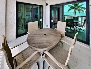 Outdoor dining - Seaside 205 | Renovated Gulf-Front Condo w/ Pool, Beach Access + Views (Fort Myers Beach)