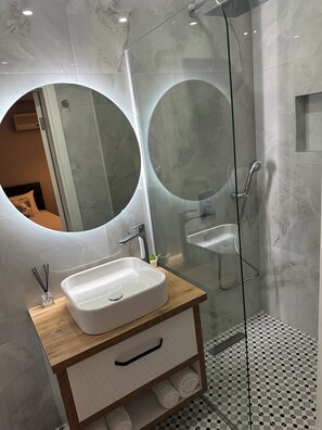 Shower, hair dryer, towels, soap
