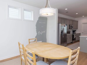 Enjoy cooking in this fully equipped kitchen with a refrigerator, microwave, and coffee maker.