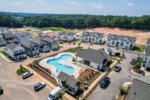 Residents enjoy a central swimming pool surrounded by homes in this family-friendly community.