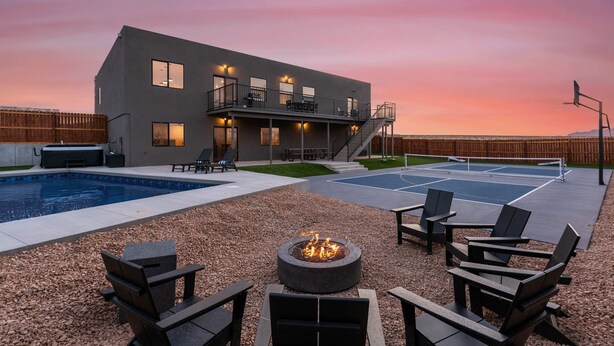 A modern house with a pool, outdoor seating, and a fire pit. - [The Grandview] Pool, Pickleball, Hot Tub, Views (Page)