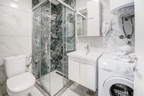 Shower, free toiletries, hair dryer, slippers