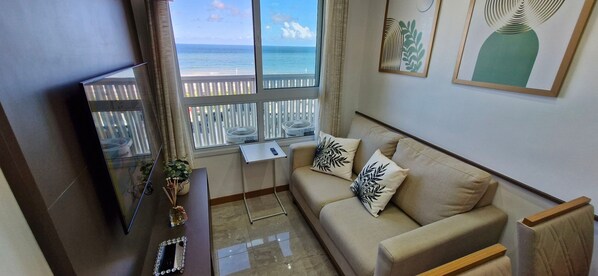 Basic Apartment | Living area | 40-inch Smart TV with digital channels, Netflix, streaming services