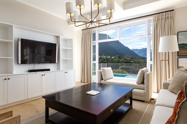 Presidential Villa, Mountain View | Living area | 250-cm Smart TV with cable channels, Netflix, streaming services - Bay Haven Collection (Cape Town)