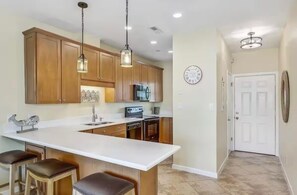 Fridge, microwave, oven, stovetop - The Salty Pelican - Waterfront 2 Bedroom/2 Bath Condo - Pensacola Beach, Florida (Pensacola Beach)