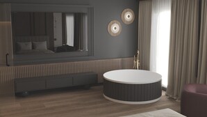 Una habitación de hotel moderna con un ventanal grande, una bañera redonda, un banco integrado y un espejo montado en la pared.
