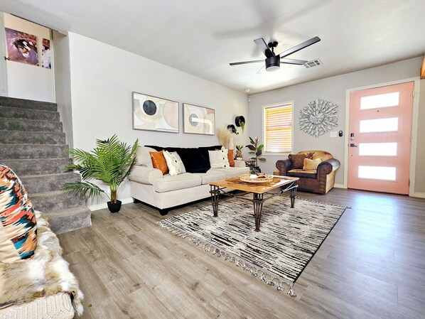 Smart TV, fireplace, books, printers