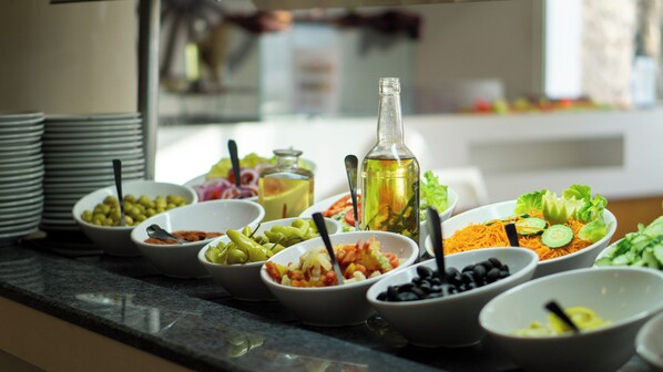 A buffet table with various food items and condiments. - Golf Residence- Family Only (Port El Kantaoui)