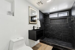 Shower, hair dryer, towels, soap