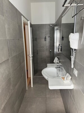 Hair dryer, towels, soap, toilet paper