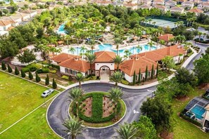 A residential area with a central circular driveway, a swimming pool, and a tennis court. - 5BR Family Home with Private Pool Solterra Resort (Davenport)