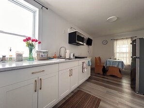 Fridge, microwave, stovetop, coffee/tea maker