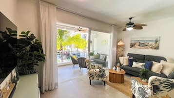 Family Apartment, 2 Bedrooms, Balcony, Pool View | Living area | 55-inch Smart TV with digital channels