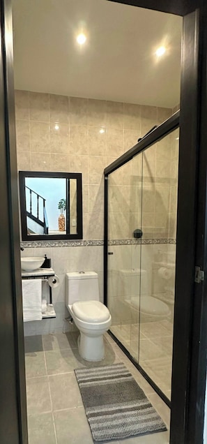 Shower, hair dryer, towels, soap