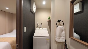 Shower, hair dryer, bidet, towels