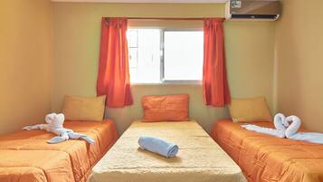 Standard Triple Room, City View | 1 bedroom, in-room safe, blackout drapes, soundproofing