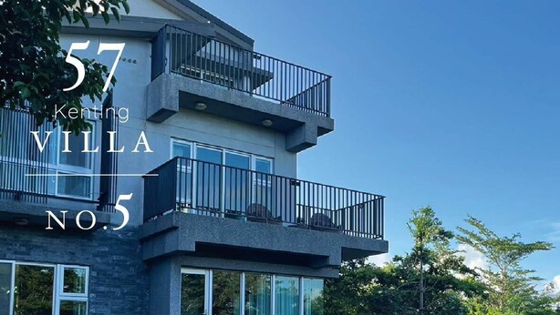A modern villa with a balcony, large windows, and outdoor seating. - 57villa (Hengchun)