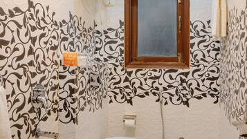 Bidet, towels, soap, toilet paper