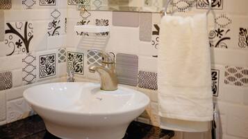 Bidet, towels, soap, toilet paper