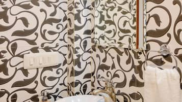 Bidet, towels, soap, toilet paper