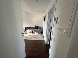 Apartamento, 1 quarto, vista para a cidade | Área de estar