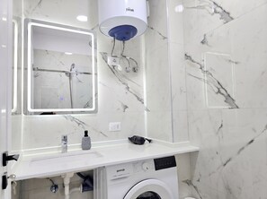 Shower, hair dryer, towels