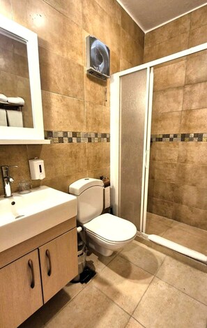 A bathroom with a toilet, sink, and shower. - Mangrove Bay Resort (El Quseir)