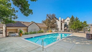 A rectangular swimming pool with a tiled edge, surrounded by a concrete deck. - DTC Studio w/ Kitchenette, Fast WiFi,Free Parking! (Greenwood Village)