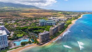 A coastal resort with multiple high-rise buildings, a beachfront, and a swimming pool area. - MK404 - Sleep at the Ocean and Watch Sunsets 3-Bed Suite (Lahaina)