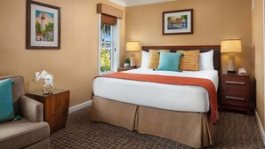 A hotel room with a large bed, two bedside tables, a chair, and two framed pictures on the walls. - Hyatt Sunset Harbor. Available Oct 19 to 26.   Studio. 3 night minimum rental.   (Key West)