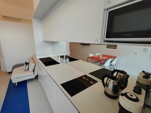 Fridge, microwave, coffee/tea maker, toaster