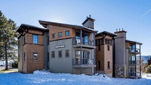 A multi-story hotel with a prominent "NORTHSTAR" sign, featuring balconies and a mix of brick and siding exteriors.