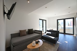 Apartamento, 1 habitación, vistas a la ciudad | Sala de estar