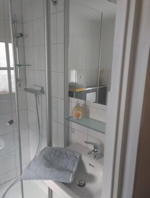 Shower, towels, soap, toilet paper