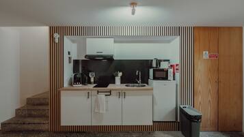 Fridge, microwave, stovetop, coffee/tea maker
