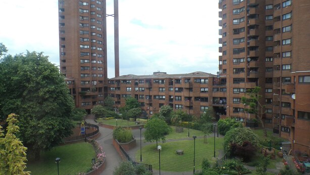 A high-rise residential building with multiple balconies and a central courtyard. - Chelsea Orange Apartment Sleeps10-petsok-parking (London)