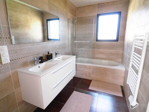 Shower, hair dryer, towels, soap