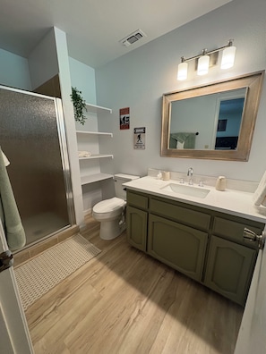 Shower, hair dryer, towels, soap