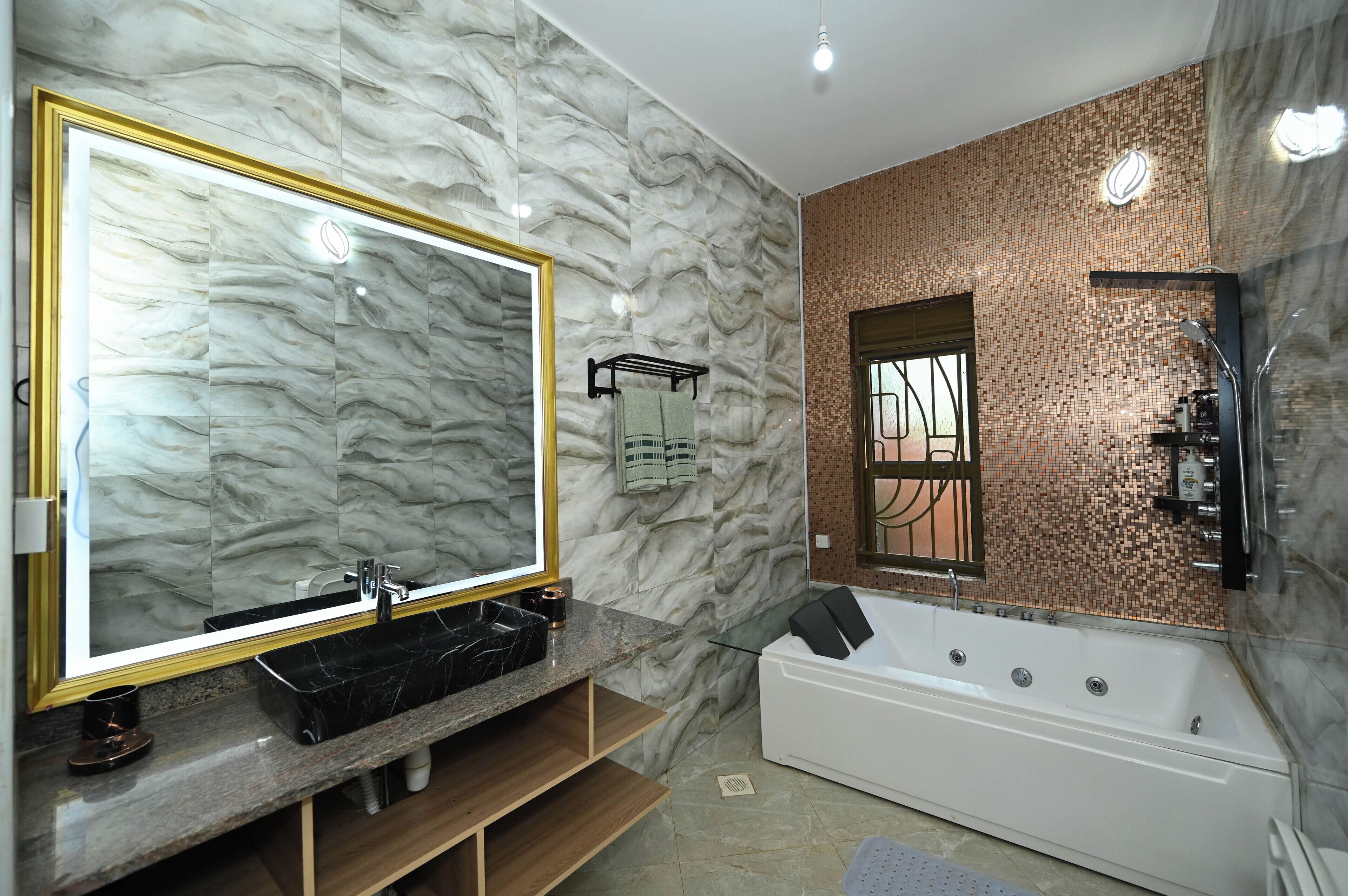 Shower, jetted tub, towels, soap