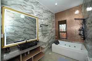 Shower, jetted tub, towels, soap