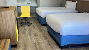 A hotel room with two beds, a desk, and a chair. - Days Inn by Wyndham Hemet (Hemet)