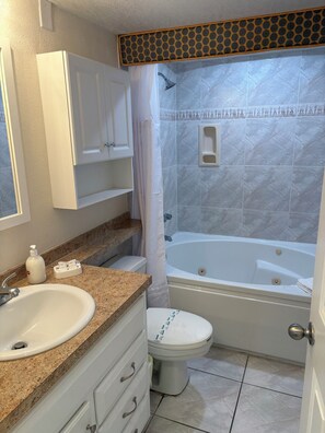 Shower, jetted tub, hair dryer, towels