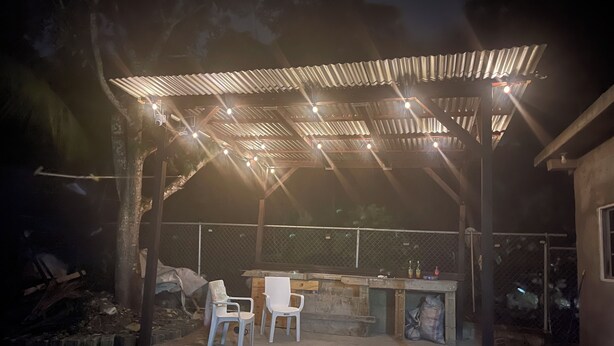 An outdoor patio area with a covered seating area, a bar, and a grill. - Modern 1-bedroom apartment with AC, WiFi and Kitchen in beautiful Negril . (Negril)