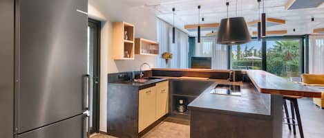 Fridge, stovetop, dishwasher, coffee/tea maker