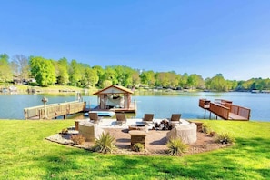 A lakeside patio with outdoor seating, a dock, and a gazebo. - Lakefront 3BR Dock + Boat Ramp, Pet-Friendly (Lake Norman of Catawba)