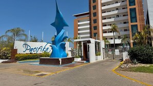 A modern building with a large blue sculpture in front, labeled "Pacifika."