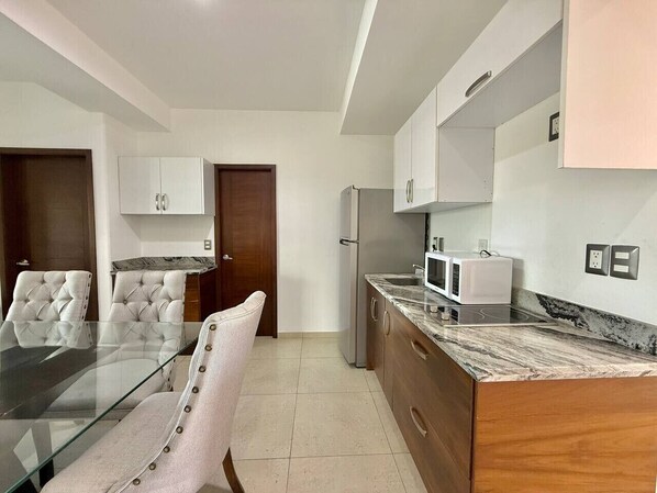 Fridge, microwave, stovetop, coffee/tea maker