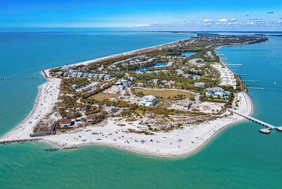 Charming Paradise w/ Beautiful Pool and waterfront Tiki Hut + Backyard Boat Ramp
